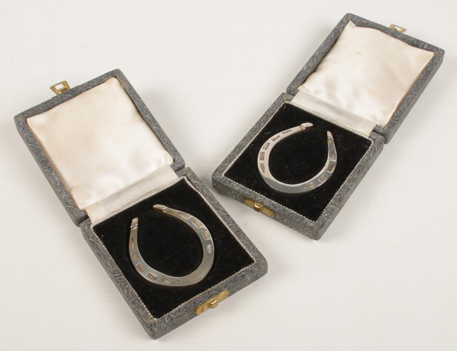 Two George V silver horseshoes. Both individually cased. Assayed Sheffield 1935 by Francis Howard