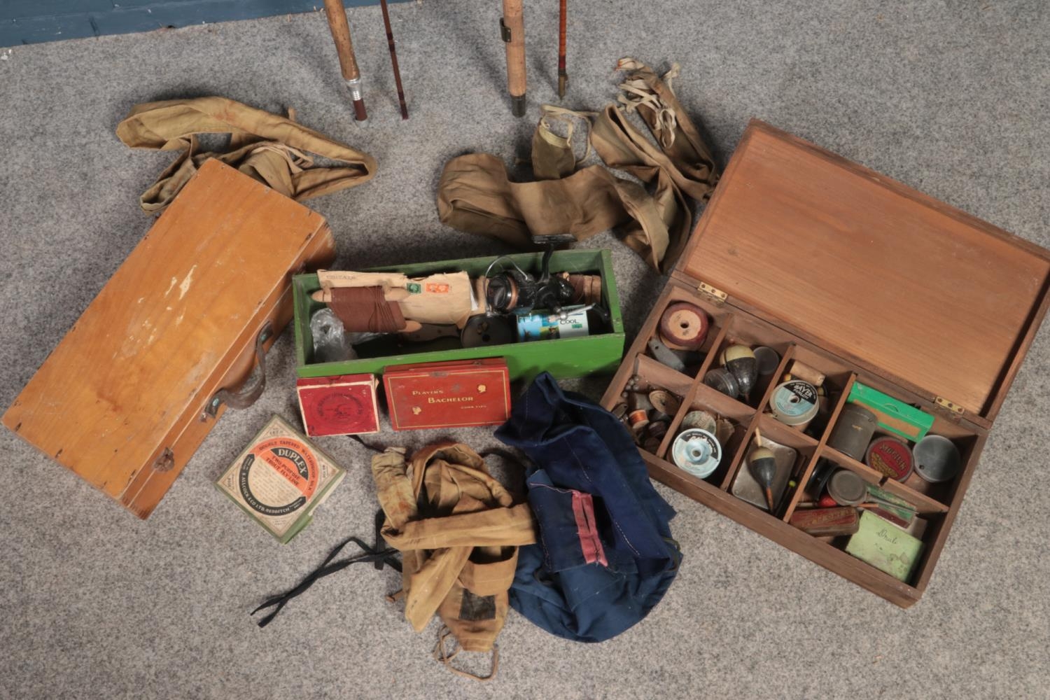 A collection of vintage fishing equipment. Includes Milward's and Bruce & Walker rods, floats,