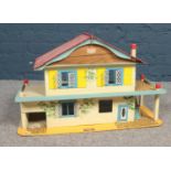 A Gee Bee Toys wooden dolls house. (68cm width, 42cm height, 29cm depth) Age/play worn