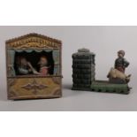 A cast iron mechanical money bank in the form of Punch and Judy, approximately 18 cm (height). To