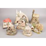 A collection of model cottages. Includes Lilliput Lane, musical example, clock etc.