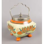 A Clarice Cliff Newport pottery Fantasque biscuit barrel. Cracked. Crazed to the bottom of the