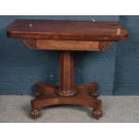 An early Victorian mahogany fold over card table.