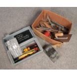 A box of tools. Includes wood boring set etc.