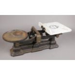 A set of cast iron kitchen scales. Joseph & Jesse Siddons Ltd. Cracked.