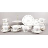A Colclough tea set. cups/saucers, milk jug, sugar bowl, cake stand, side plates examples etc.