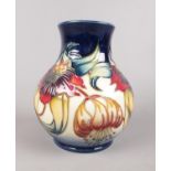 A Moorcroft 'Anna Lily' vase: Designed by Nicola Slaney. H:16cm. (Unboxed) Condition good. No