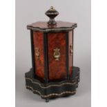 A Victorian burr walnut and ebony musical cigar dispenser, adorned with ormolu decoration. Good