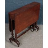 A Victorian mahogany Sutherland table raised on turned support.