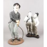 Two ceramic figures. Charlie Chaplin (38cm height) & Laurel & Hardy (29cm height).