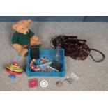 A box of miscellaneous. Includes Italian Borsa Lino handbag, Harrods bear, vintage tinplate toys,