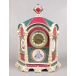 A large decorative pottery mantel clock. Decorated with figural panels depicting Louis XV, Duchess