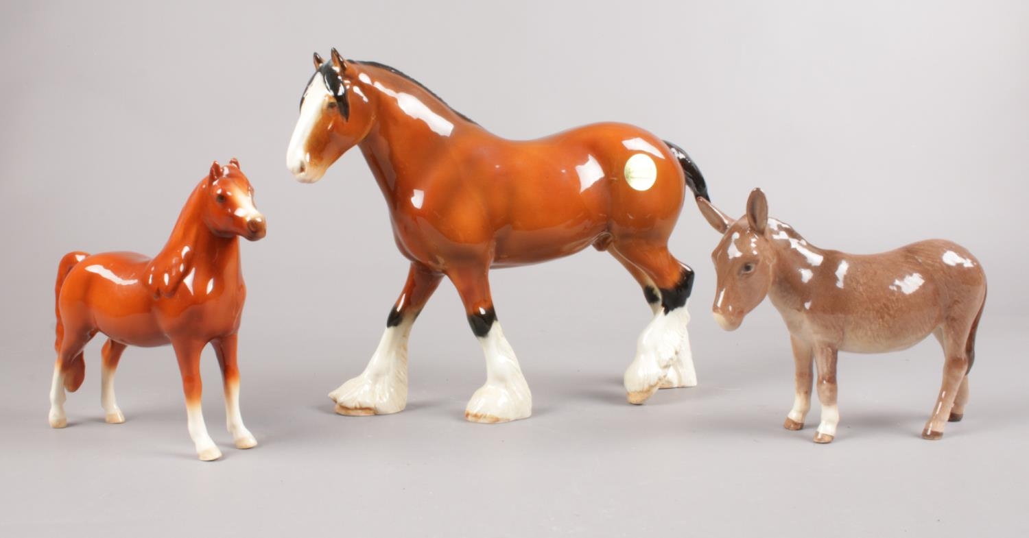 A group of Beswick figures. Brown Shire Horse (18cm height), Brown Welsh Mountain Pony (8cm height),