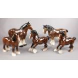 A group of mainly Beswick Horse figures. Three brown shire horses (21cm height) and two similar