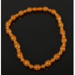 An apricot amber and yellow metal necklace with screw cup fastener 46 cm long Good condition