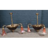 A pair of three armed brass ceiling lights - decorated with glass opalized deep pink shades. H: