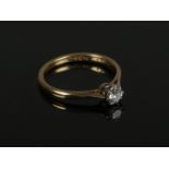 A 18ct yellow Gold & Platinum Solitaire Diamond ring size M. approx. 1/8. Weight: 2.4g. Condition