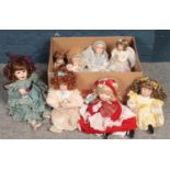 A box of dolls. Including Hamilton collection, bisque headed examples, etc.