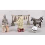 A group of oriental style figures. carved soapstone figure, seal stones examples etc.