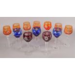 A selection of twelve tall stem cut glass wine goblets - comprising of three various colours, cobalt