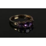 A 9ct yellow gold Amethyst/Diamond ring, size P. Weight 1.54g, largest Amethyst 5mm. Condition
