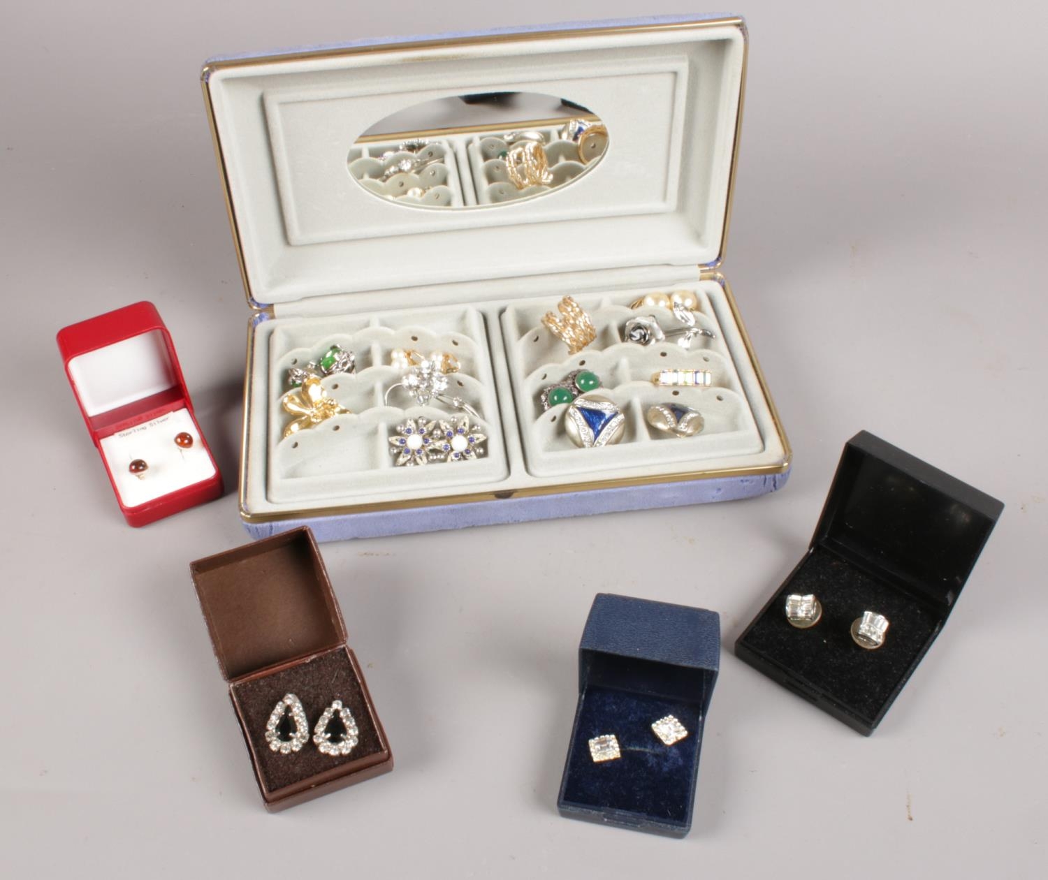 A collection of costume jewellery. Mainly earrings (clip on/stud), brooches, rings examples etc.