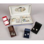 A collection of costume jewellery. Mainly earrings (clip on/stud), brooches, rings examples etc.