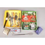 Two boxes of collectables. Includes wristwatches, silver handle button hook, tin plate cars,