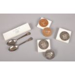 A collection of mainly silver items by George Falconer & Co, Hong Kong. Includes spoons and medals.