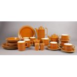 A collection of Hornsea Pottery 'Saffron'. Coffee pot, teapot, mugs, milk jug, plates examples etc