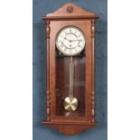 A modern William Widdop Mahogany pendulum wall clock.