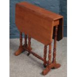 A small mahogany Sutherland table raised on turned support. C1900 (H58cm)