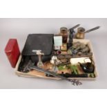 A box of miscellaneous. Includes binoculars, metalwares, Tasco scope etc.