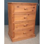 A solid Pine chest of four drawers on plinth base. H:94cm,W:66cm,D:45cm. Condition good. Just a