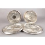 Four silver plated trays - comprising of two handmade circular trays and two oval trays with the