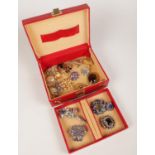 A jewellery box of mostly 1950s paste set brooches.