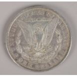 An American silver dollar, 1887.