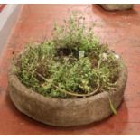 A circular stone planter. (Height 19cm, Diameter 70cm).