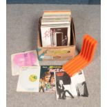 A box of LP records. Also includes retro record holder.