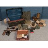 Militaria -A twin handle tin trunk with contents of WW2 military equipment. To include gas mask,