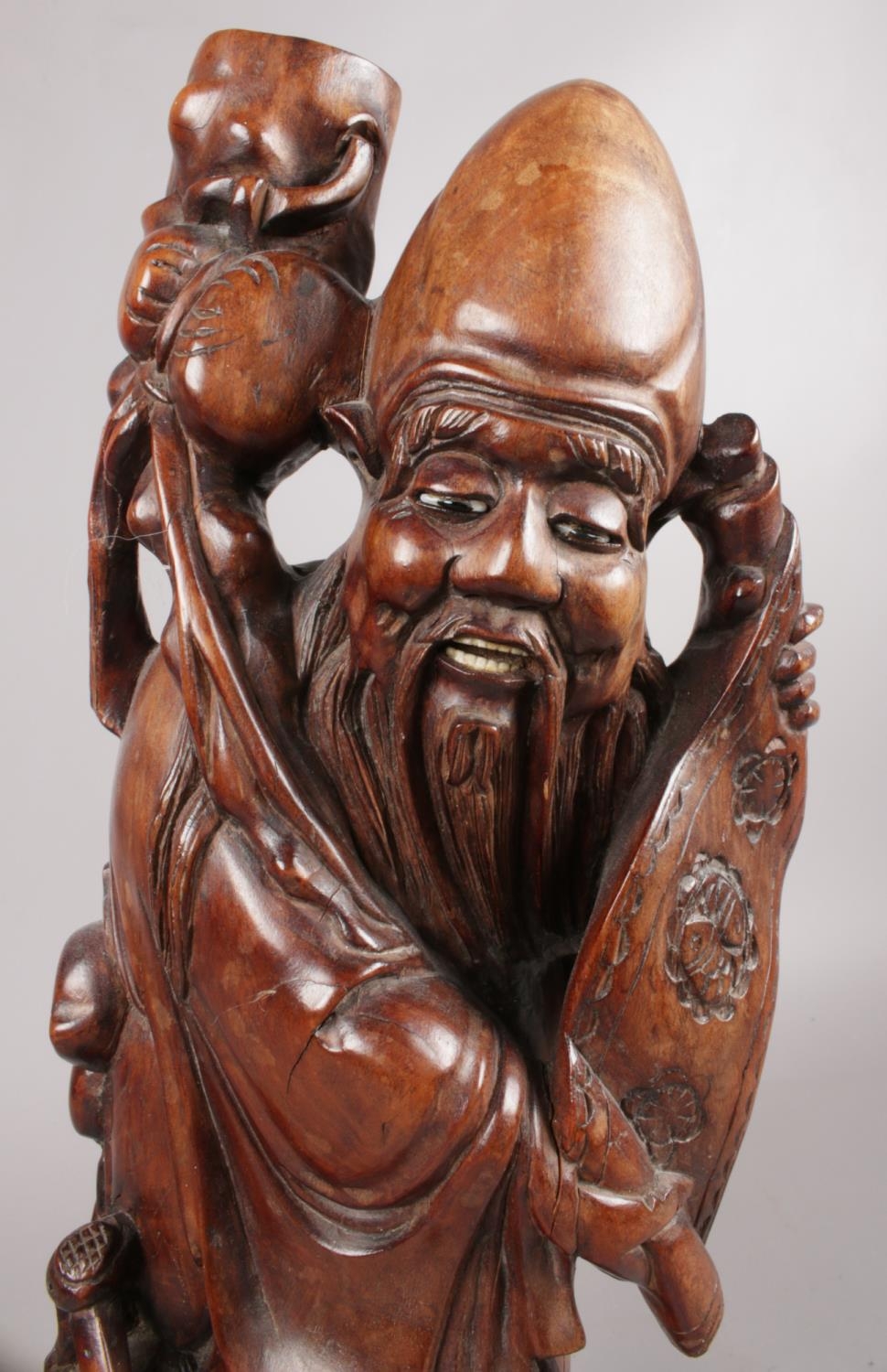 A hardwood oriental carved figure depicting a sage figure with scroll. This figure has ivory - Image 3 of 4