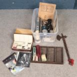 A box of miscellaneous. Includes Crescent Toys signal post, axe, composite Buddha figure, cutlery