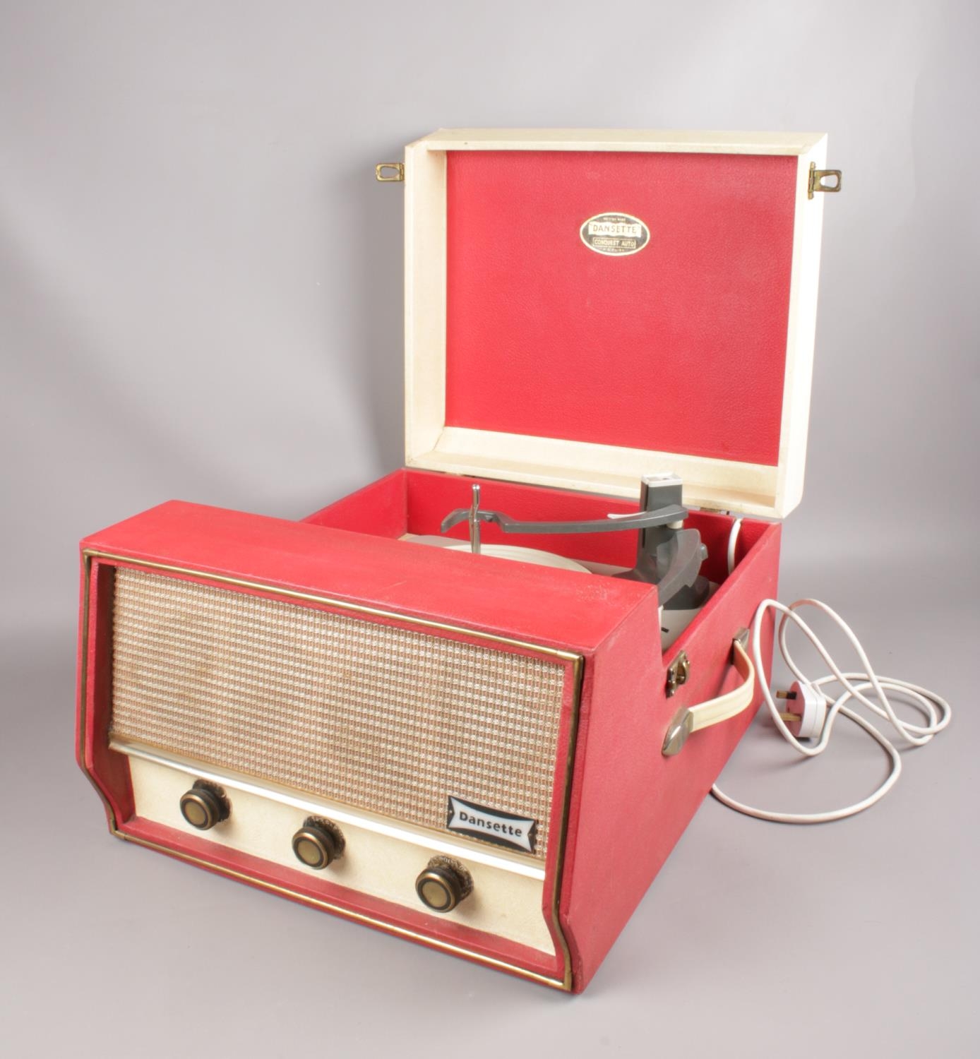 A Dansette 'Conquest Auto' portable record player (missing legs) in red and cream. H:25.5cm, W: 40. - Image 2 of 3