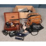 A box of photographic. Includes Canon EOS 1000F, Agfa, Yashica binoculars, lenses etc.