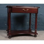 A Mahogany occasional table with single drawer made by 'Rossmore'. H: 61cm, W:63.5cm, D:47.5cm.