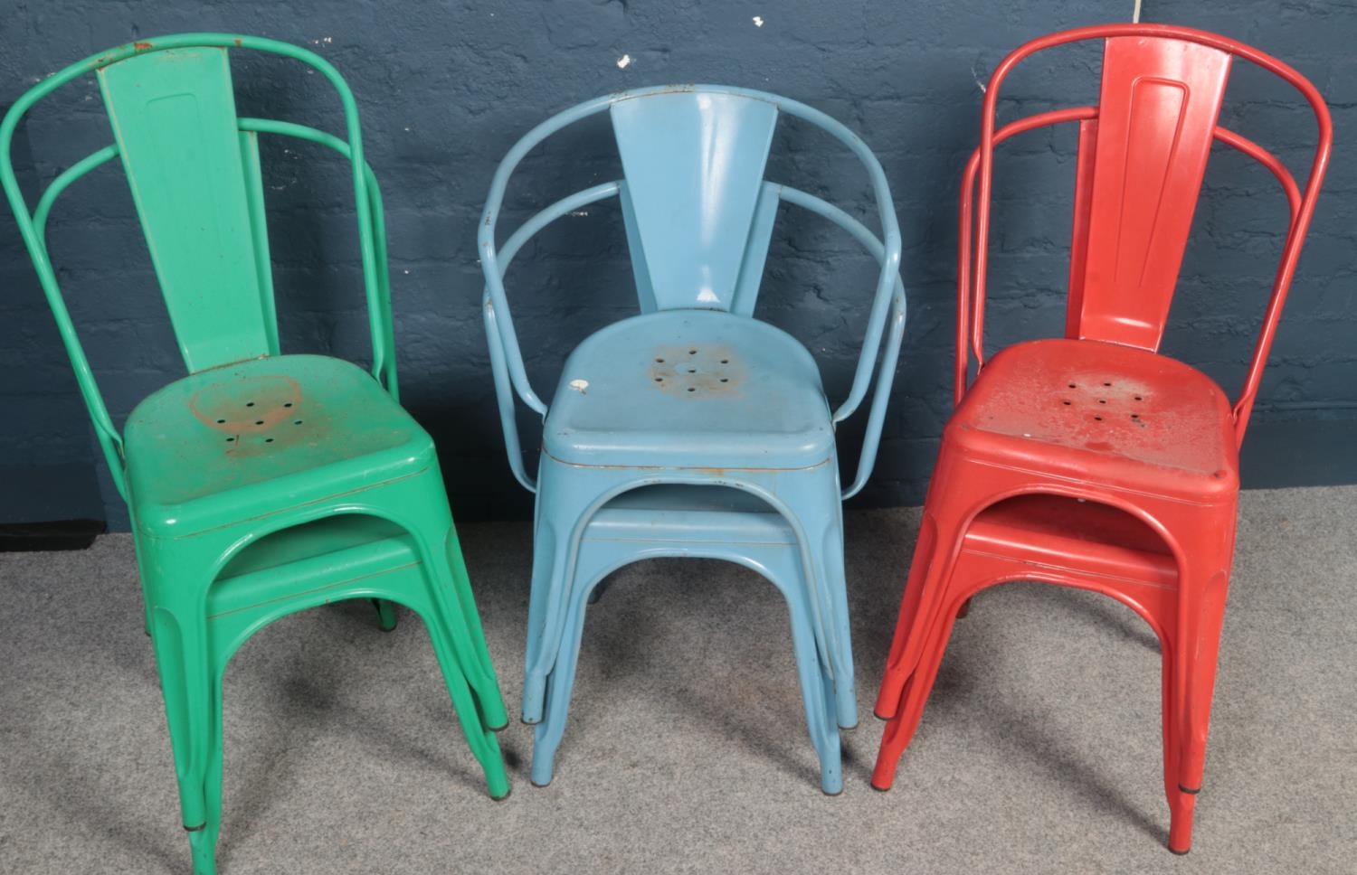 A set of 6 painted steel tubular stacking chairs.