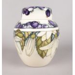 A Moorcroft ginger jar - decorated with blueberries & white flowers (Juneberry), dated 2000. H: