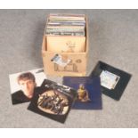 A box of LP records. Includes Led Zeppelin, The Beach Boys, John Lennon etc.