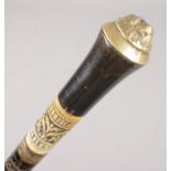 A Victorian ebonised walking stick. With brass lion mask pommel.