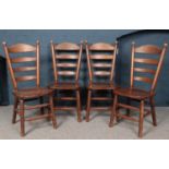 A set of 4 oak ladder back dining chairs.